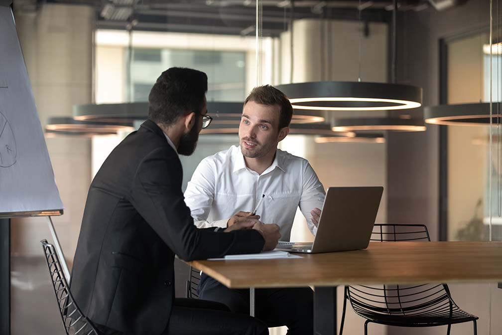 man explaining the benefits of automotive consulting to business