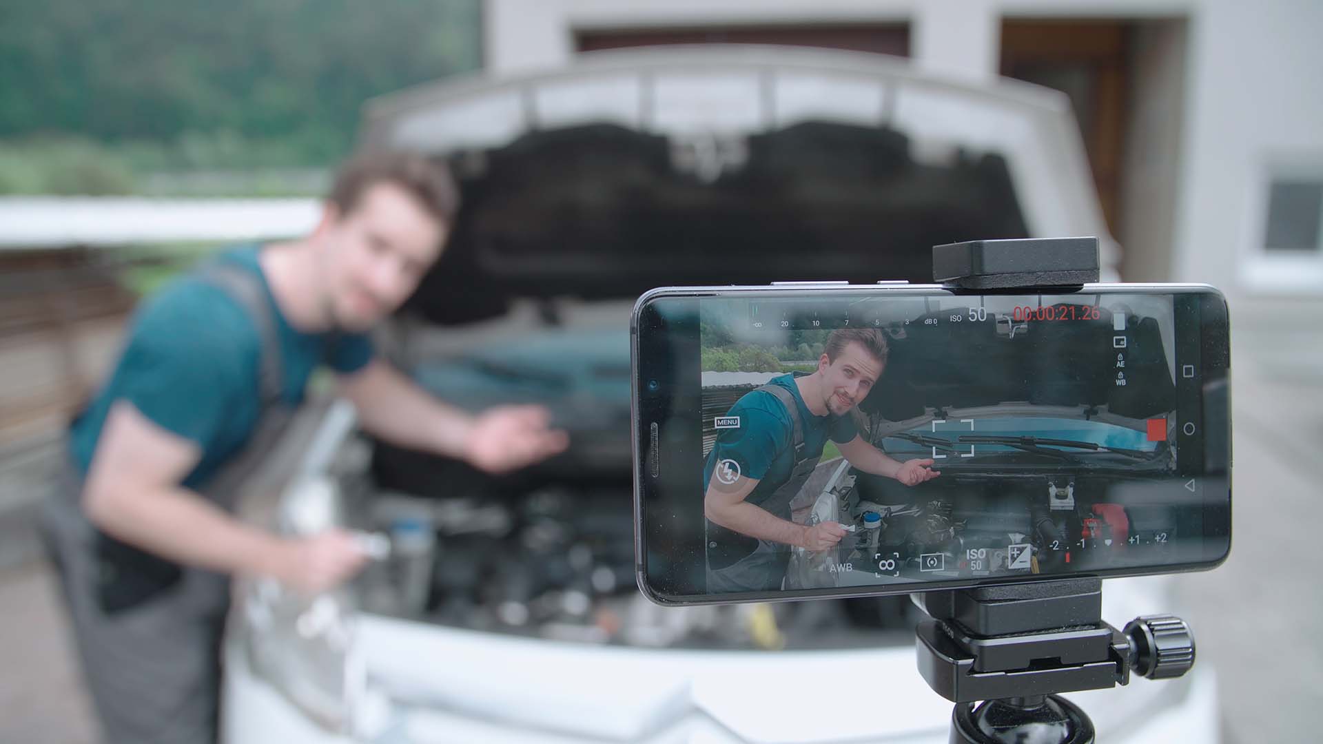 man working in multimedia production, filming a video