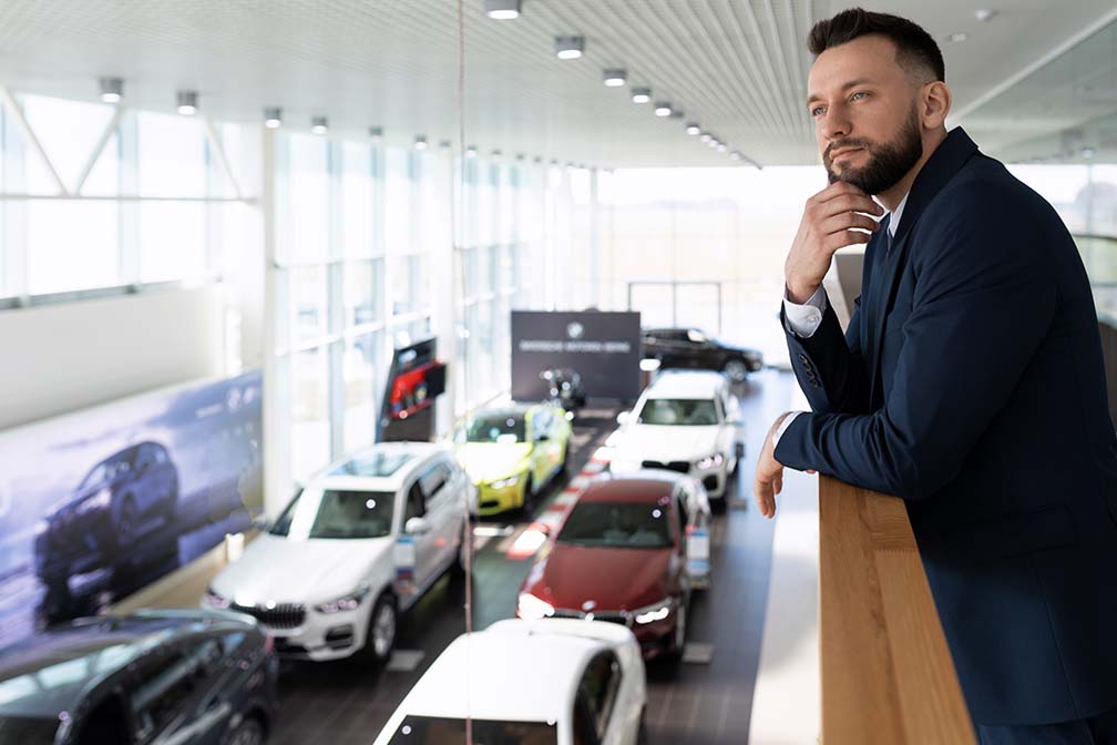 owner of a dealership understanding how vehicle subscriptions will benefit his business